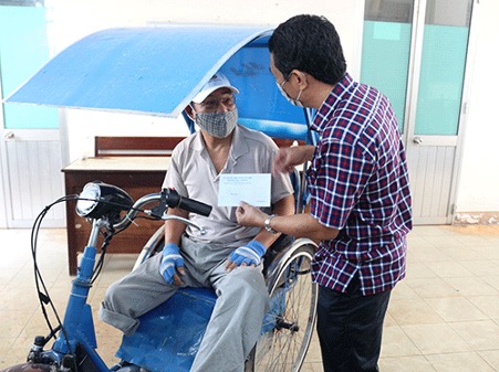 A person sitting on a cartDescription automatically generated